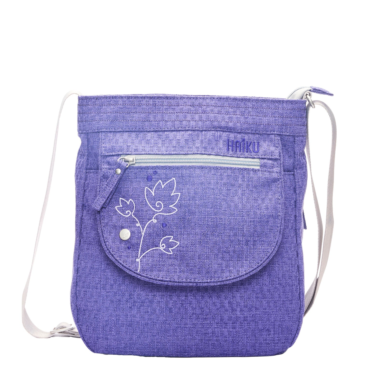 Purple drawstring bag with floral design and 'Haiku' branding on a white background