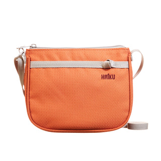 orange women's crossbody handbag on a white background