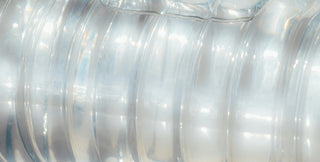 Close-up of clear plastic bottles with a focus on the material and texture.